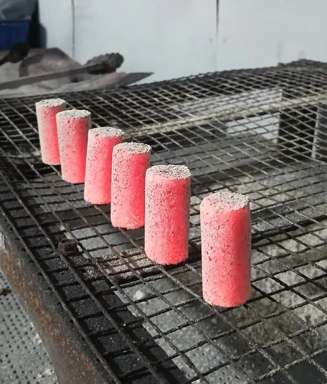 Finger-stick coconut charcoal briquettes burning evenly